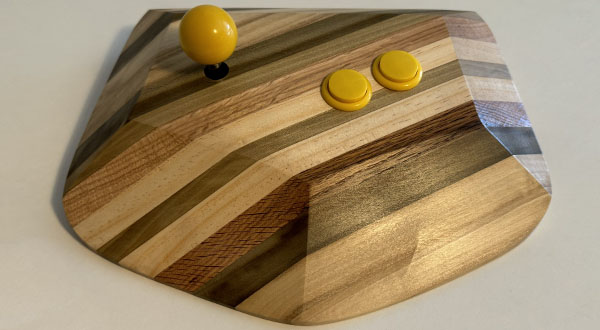 Photograph of a wooden video game joystick