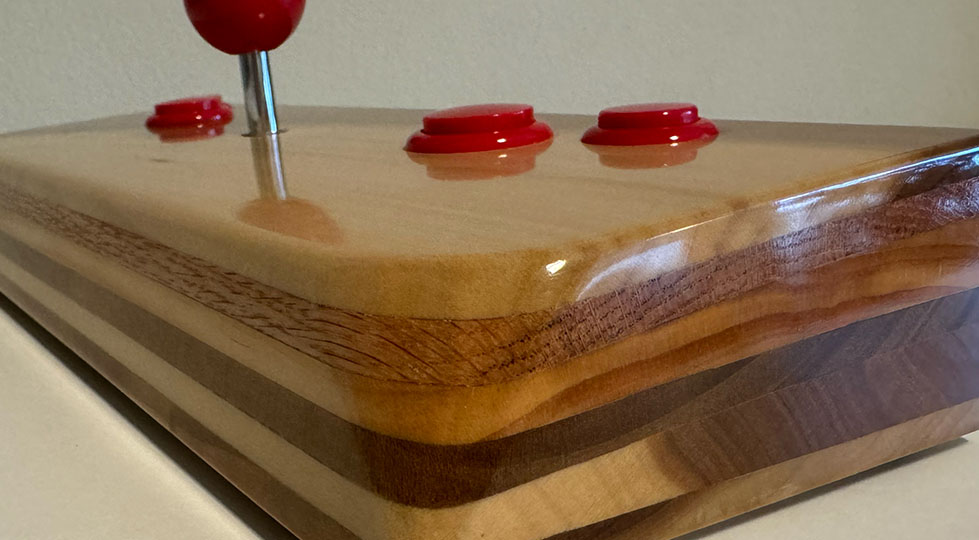 Photograph of a wooden video game joystick