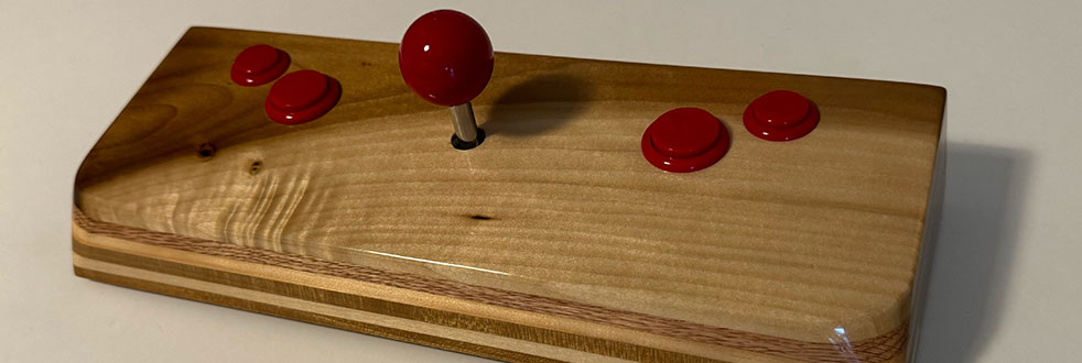 Photograph of a wooden video game joystick