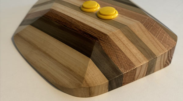 Photograph of a wooden video game joystick