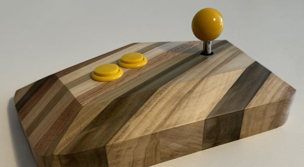 Photograph of a wooden video game joystick